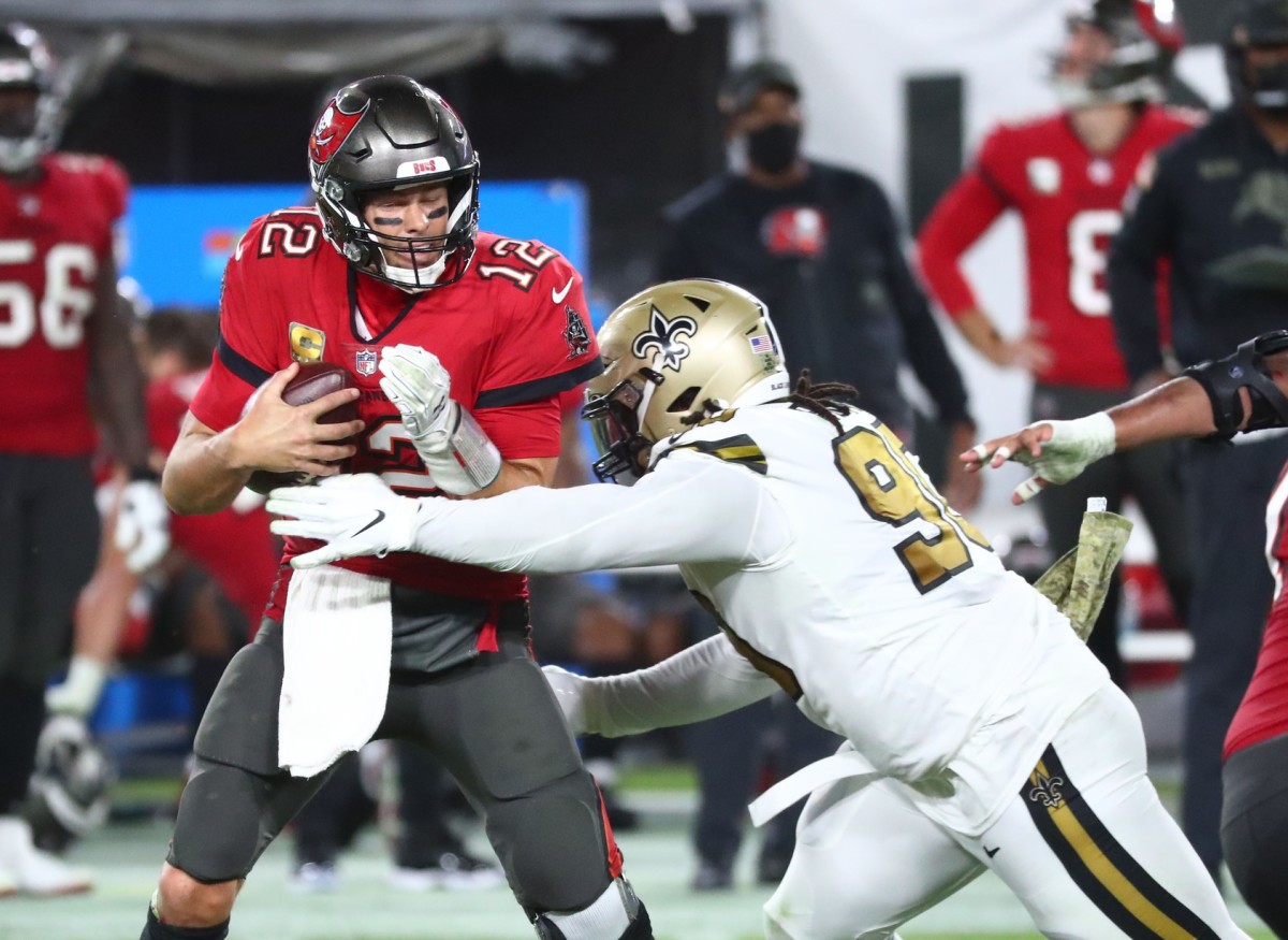 Nov 8, 2020; New Orleans Saints defensive tackle Malcom Brown (90) sacks Buccaneers quarterback Tom Brady (12). Mandatory Credit: Kim Klement-USA TODAY Sports